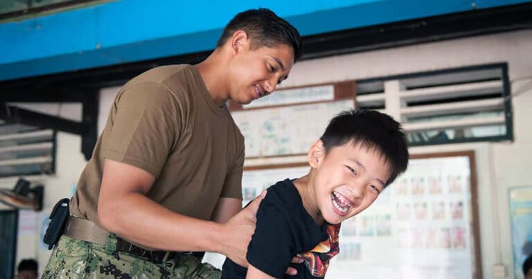 Father wth cerebral palsy adopted son