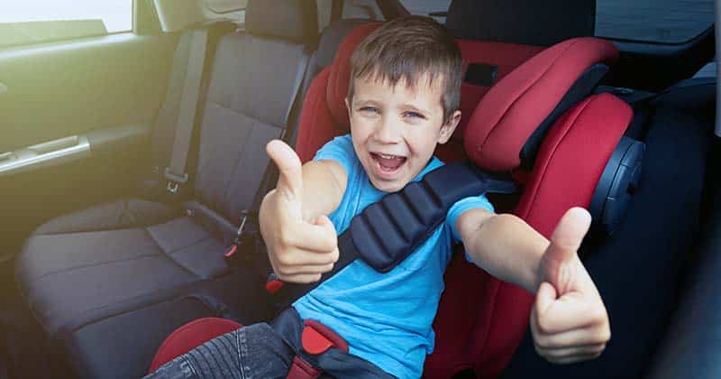 Happy boy in car