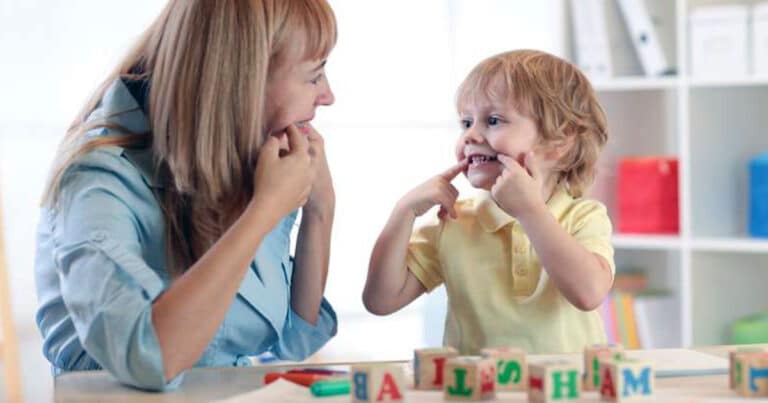 Mother with son doing fun speech therapy activities